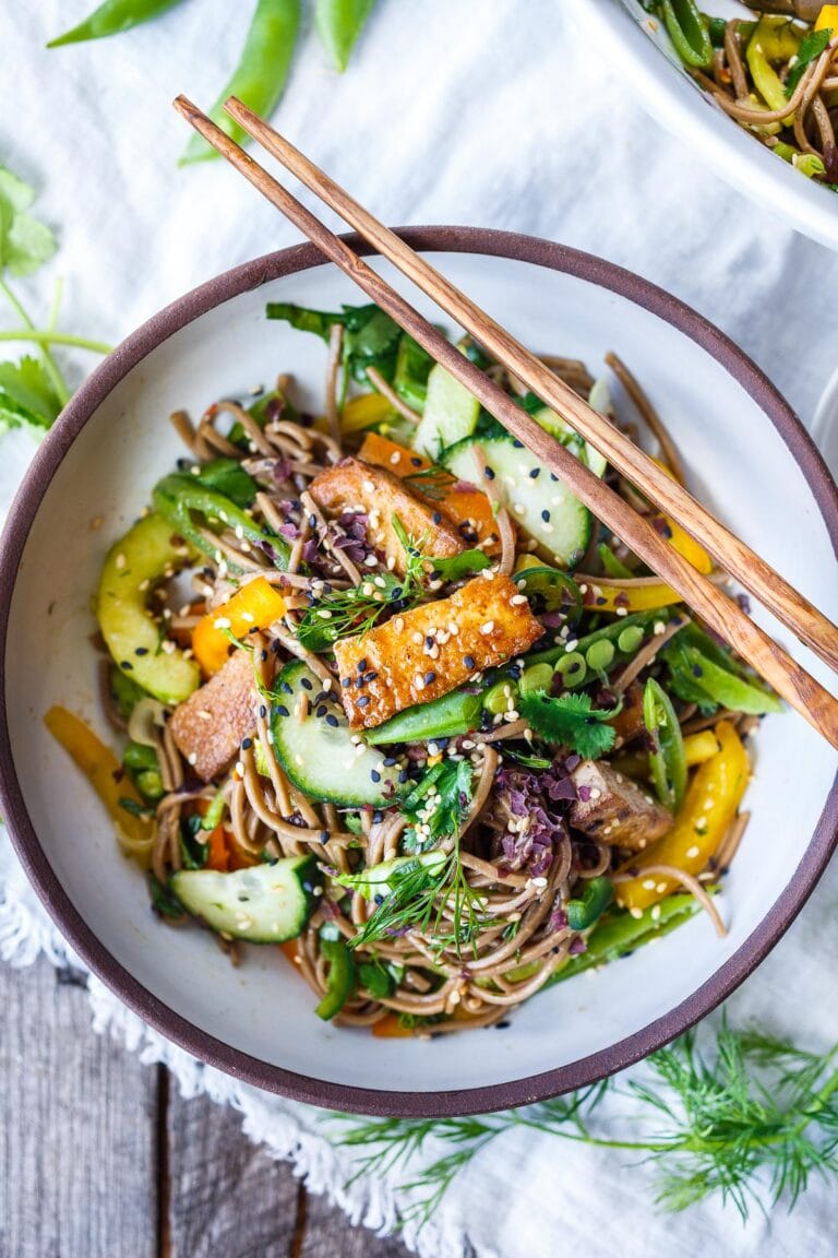 This Soba Noodle Salad recipe is vegan, loaded with healthy seasonal veggies, and tossed in the most delicious sesame-soy dressing! Quick and easy.