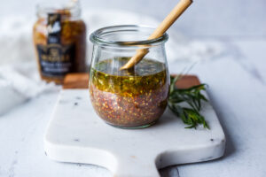 Bright and tangy, this Mustard Seed Maple Dressing with tarragon and shallots is the perfect complement to roasted or grilled veggies and hearty salads.  Easy, quick, and Vegan!