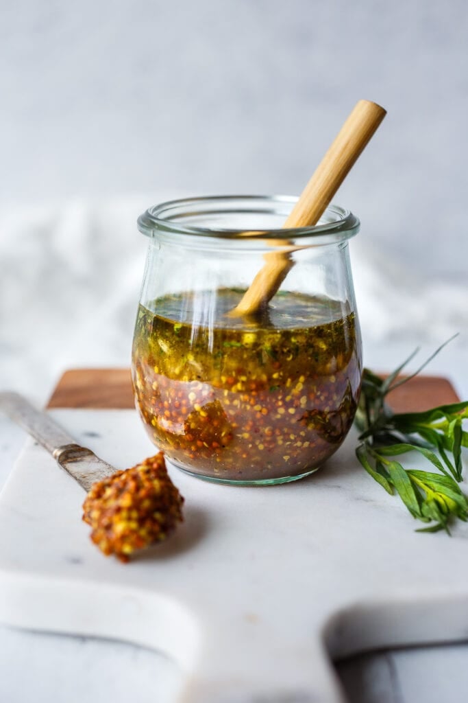 Bright and tangy, this Mustard Seed Maple Dressing with tarragon and shallots is the perfect complement to roasted or grilled veggies and hearty salads.  Easy, quick, and Vegan!