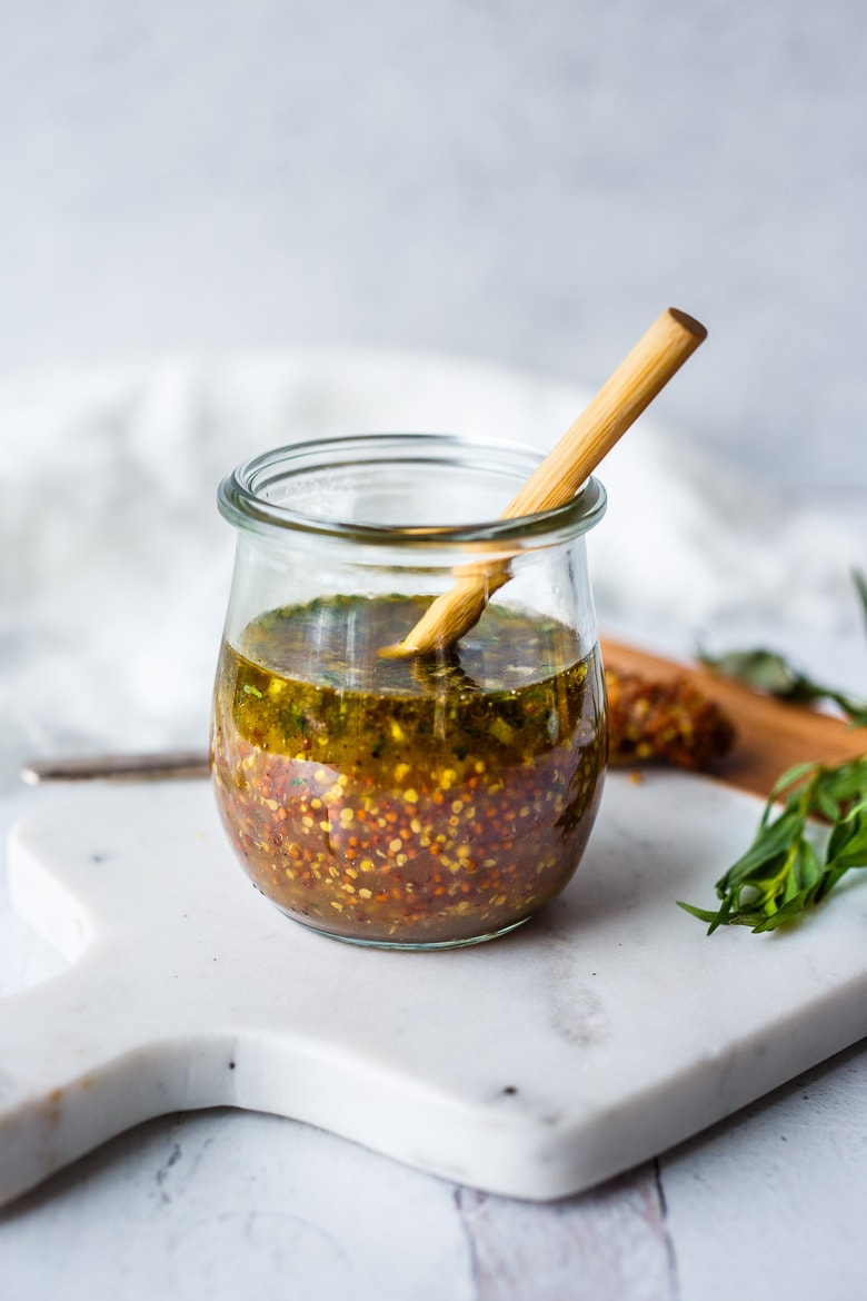 Bright and tangy, this Mustard Seed Maple Dressing with tarragon and shallots is the perfect complement to roasted or grilled veggies and hearty salads.  Easy, quick, and Vegan!