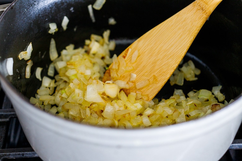 saute the onion and garlic in a dutch oven