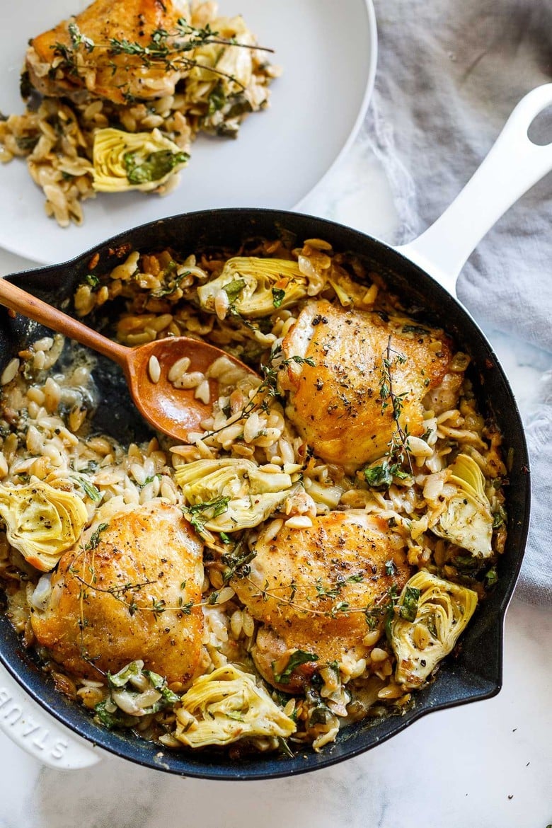 One Skillet Creamy Orzo Chicken with Artichoke Hearts- a deliciously cozy dinner, made with simple pantry ingredients, perfect for busy weeknights. 