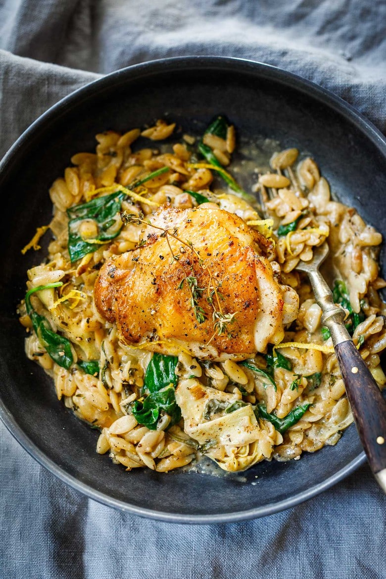 One Skillet Creamy Orzo Chicken with Artichoke Hearts- a deliciously cozy dinner, made with simple pantry ingredients, perfect for busy weeknights. 