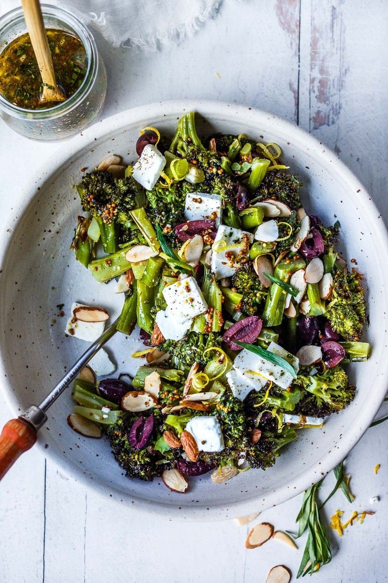 Easy Roasted Broccoli Salad with toasted almonds, kalamata olives, and lemon zest, drizzled with delicious Mustard Seed Maple Dressing.  A perfect potluck recipe. Amazingly simple, yet filled with so much vibrant flavor. 