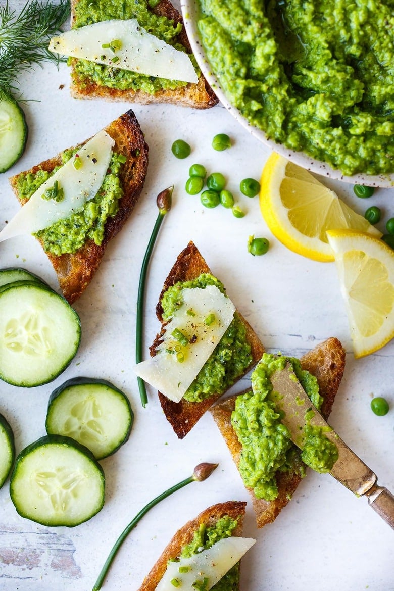 Quick and easy to make, this Spring Pea Pesto is deliciously vibrant with fresh herby flavor.  Perfect for a dip, spread or use as a sauce with pasta and buddha bowls.  Vegan and gluten free!
