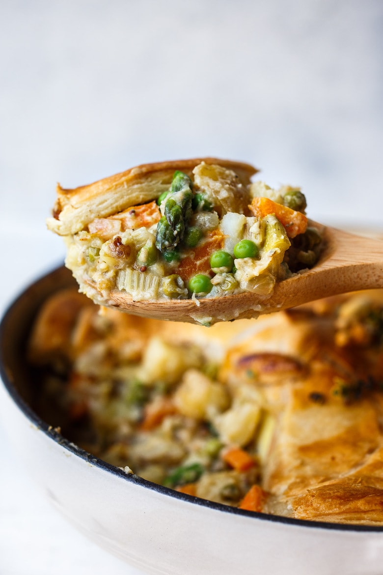 Vegan Pot Pie with Spring Vegetables is loaded with vibrant fresh veggies and flavorful herbs cooked in a delicious creamy lemon mustard sauce and topped with a flakey puff pastry crust.  