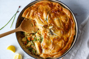 This Vegan Pot Pie is loaded with vibrant fresh spring veggies and flavorful herbs cooked in a creamy lemon mustard sauce topped with a flakey puff pastry crust.