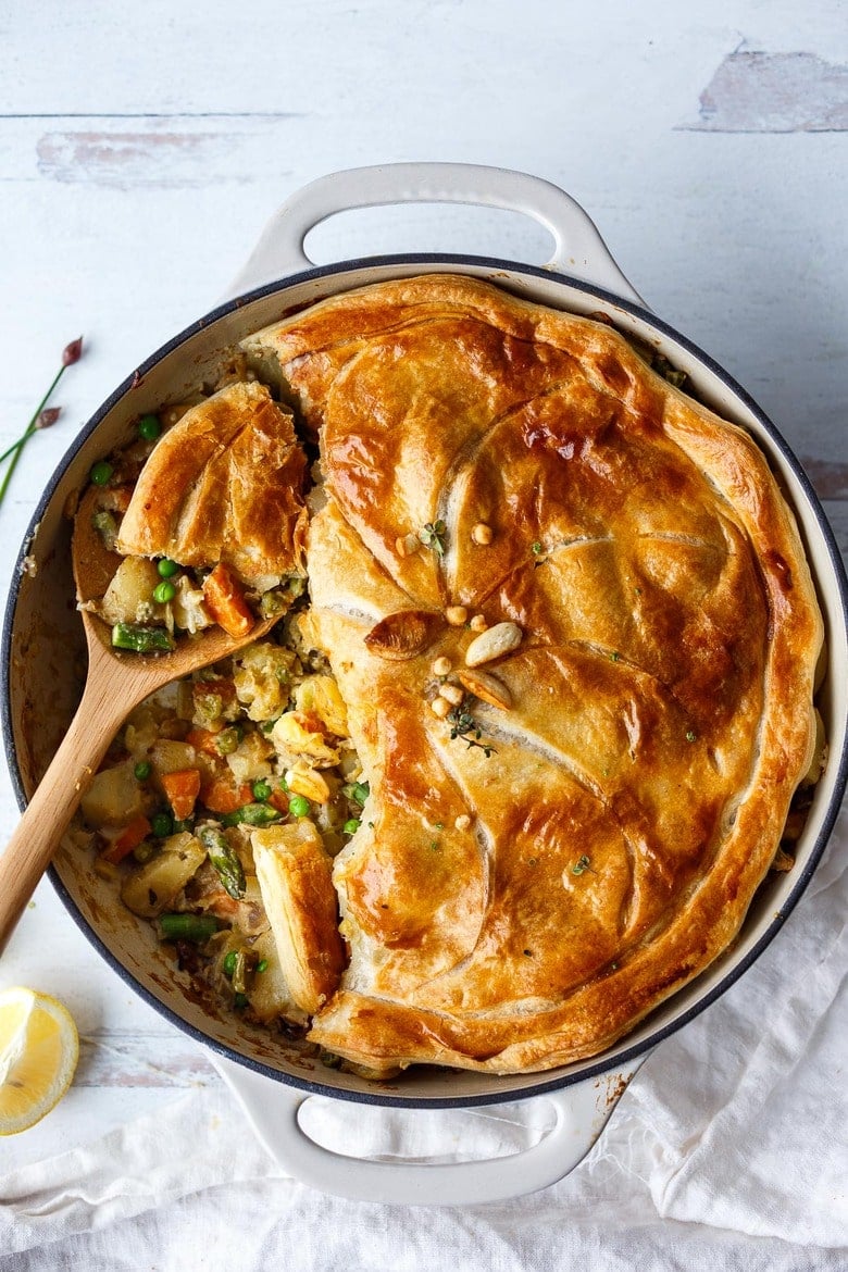 Vegan Pot Pie with Spring Vegetables is loaded with vibrant fresh veggies and flavorful herbs cooked in a delicious creamy lemon mustard sauce and topped with a flakey puff pastry crust.  