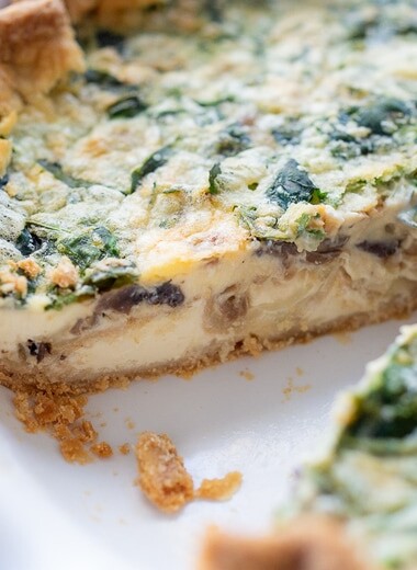 Learn the secret to making the perfect quiche every time! This Quiche Recipe features a buttery, flakey crust filled with a silky-smooth, creamy custard and your choice of veggies or greens. 