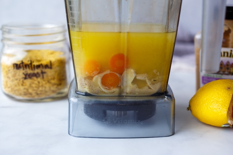 blending sauce to make vegan hollandaise.