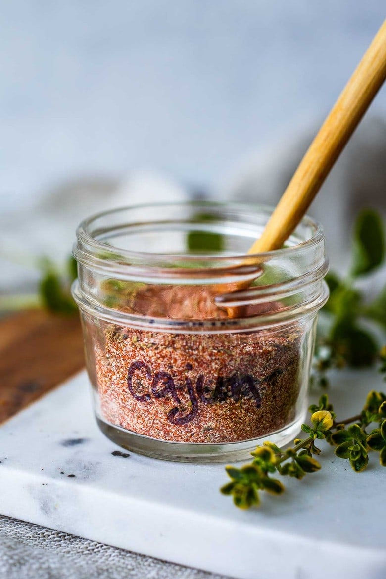 This simple Cajun Seasoning Recipe is made from basic pantry spices- easy to make in about 5 minutes!  Customize your own savory zesty spice blend that is more flavorful than store-bought!