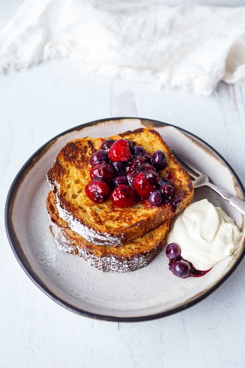 25 Mother's Day Brunch Ideas| An easy recipe for tender French Toast enhanced with spices, orange zest, and lightly sweetened with maple syrup.  Top with Fresh Berry Compote for a perfect weekend breakfast treat.