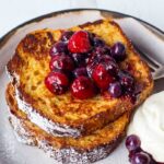 An easy recipe for tender French Toast enhanced with spices, orange zest, and lightly sweetened with maple syrup.  Top with Fresh Berry Compote for a perfect weekend breakfast treat.