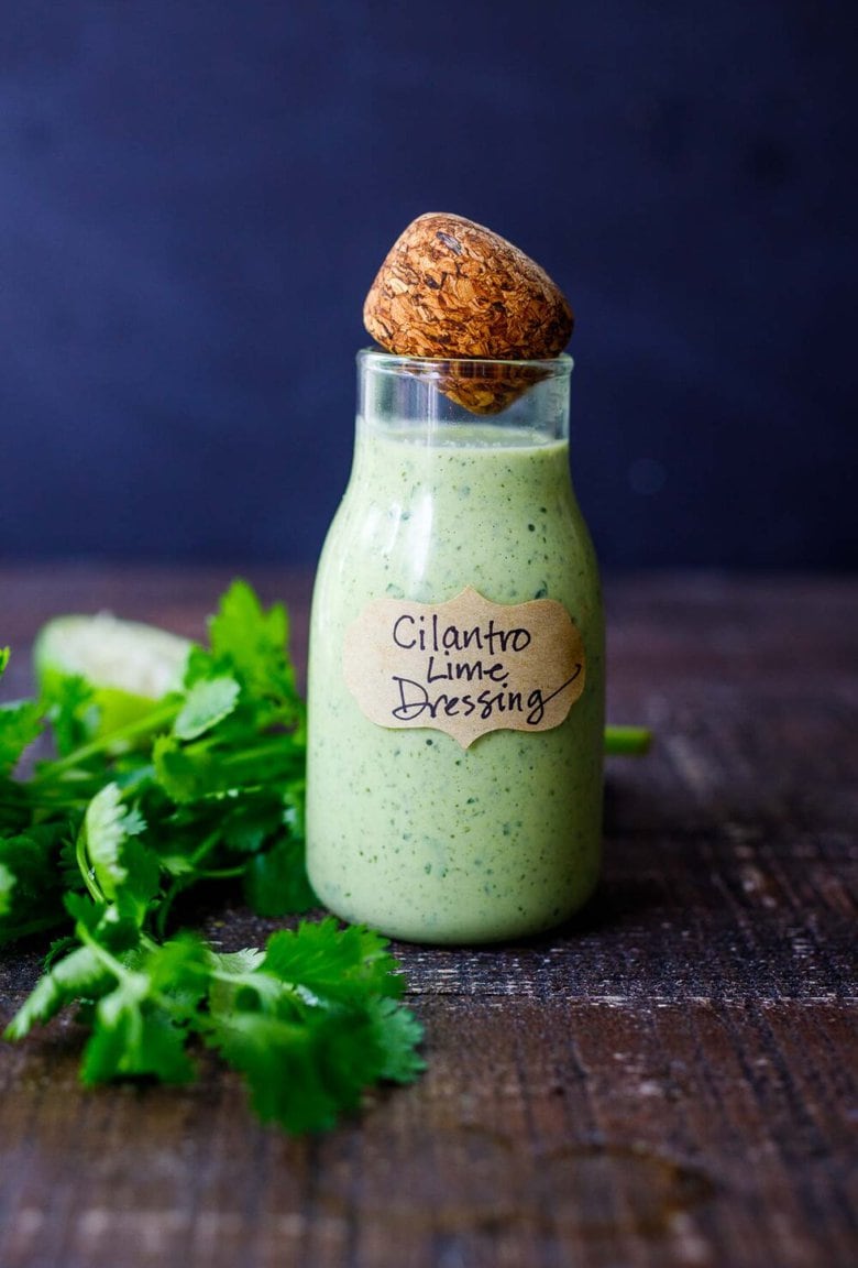 This Creamy Cilantro Lime Dressing is begging to be on your next salad! Tangy, with a hint of heat from jalapeno, it will make your salad sing! Vegan-adaptable!
