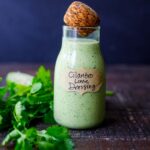 This Creamy Cilantro Lime Dressing is begging to be on your next salad! Tangy, with a hint of heat from jalapeno, it will make your salad sing! Vegan-adaptable!