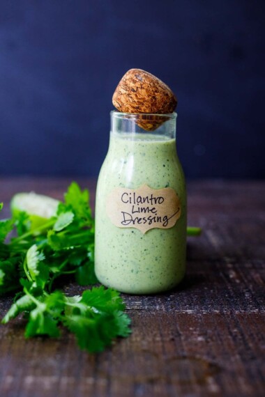 This Creamy Cilantro Lime Dressing is begging to be on your next salad! Tangy, with a hint of heat from jalapeno, it will make your salad sing! Vegan-adaptable!