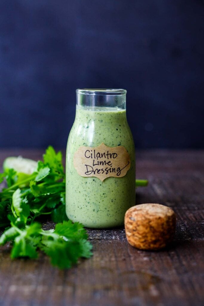 This creamy Cilantro Lime Dressing is begging to be on your next salad! Tangy, with a hint of heat from jalapeno, it will make your salad sing! Vegan-adaptable!
