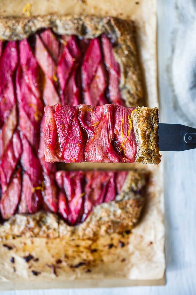 A rustic Rhubarb Tart with lemon, cardamom and vanilla tucked into a flakey free-form buckwheat crust.  Simple, elegant, and delicious!