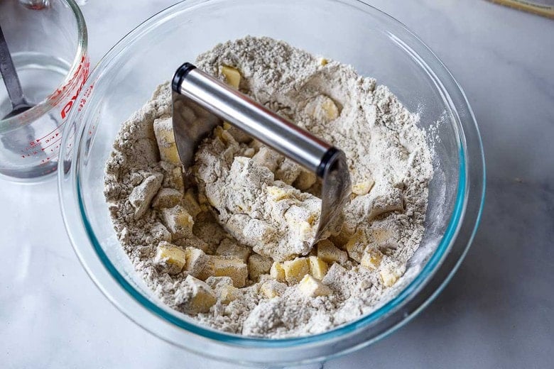 cutting the butter into the flour