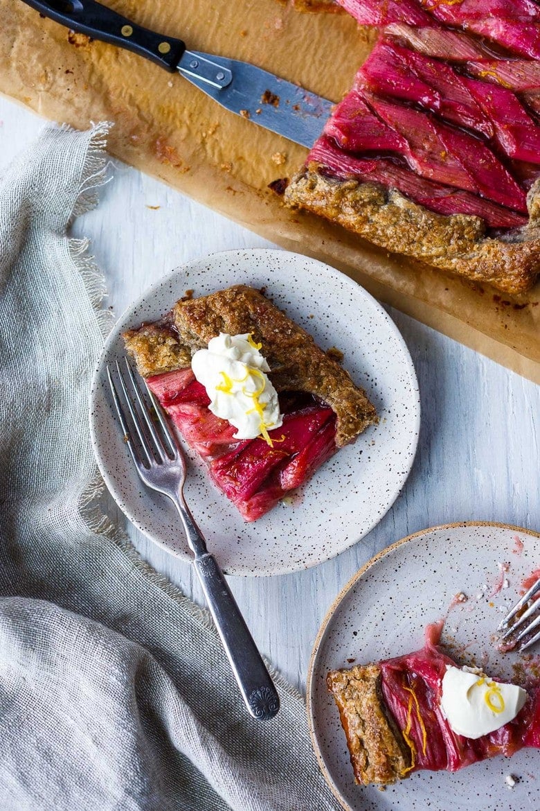 A rustic Rhubarb Tart with lemon, cardamom and vanilla tucked into a flakey free-form buckwheat crust.  Simple, elegant, and delicious!