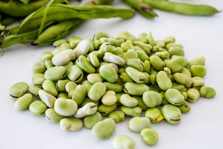 shucked fava beans on the counter.