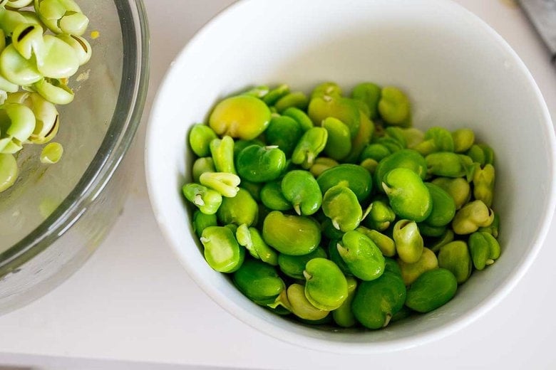 peeled fava beans in a bowl