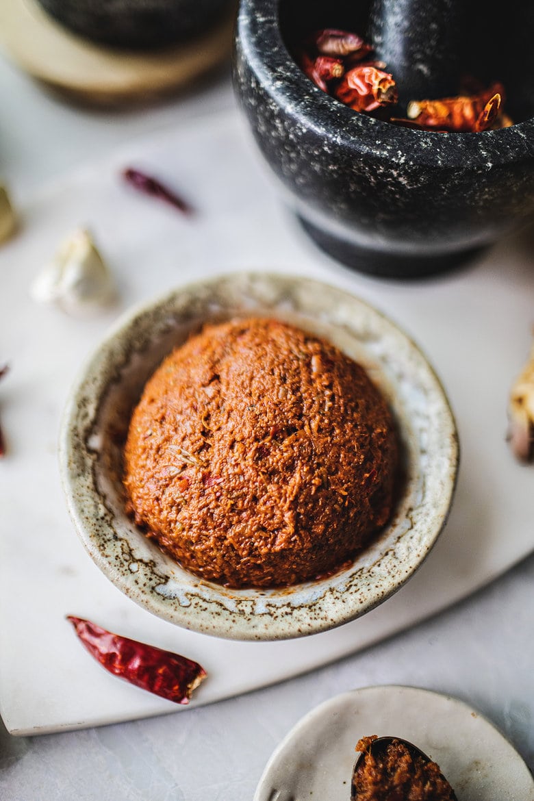 Making authentic Thai Red Curry Paste from scratch is fast and easy and can be made in under 30 minutes. Make it in a food processor or use a mortar and pestle for a more authentic approach -both yield incredible flavors and aromas that will give your Thai dishes delicious flavor. Vegan-adaptable!