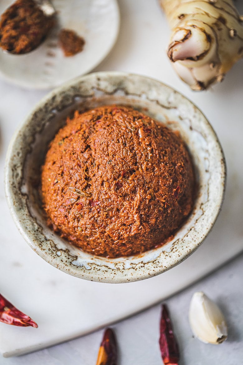 Making authentic Thai Red Curry Paste from scratch is fast and easy and can be made in under 30 minutes. Make it in a food processor or use a mortar and pestle for a more authentic approach -both yield incredible flavors and aromas that will give your Thai dishes delicious flavor. Vegan-adaptable!