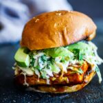 Crispy BBQ Tofu Sandwich topped with cool and creamy cilantro cabbage slaw, that can be made in under 30 minutes - plus it is vegan.