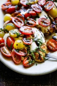 This recipe for Caprese Chicken is easy to make, with simple ingredients. It's bursting with summertime flavor and can be made in 30 minutes! Perfect for alfresco dining or outdoor gatherings. 
