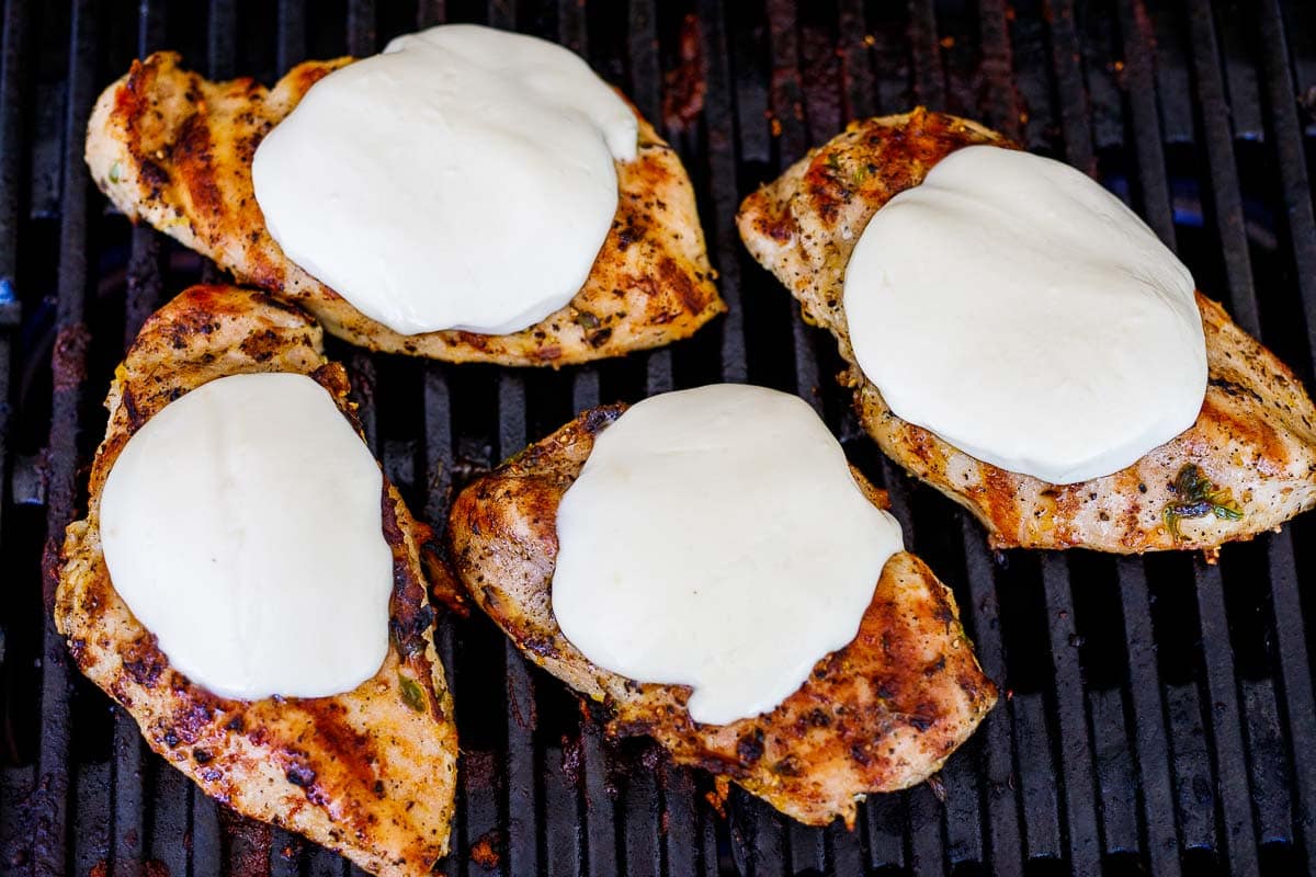 mozzarella melting on the the chicken