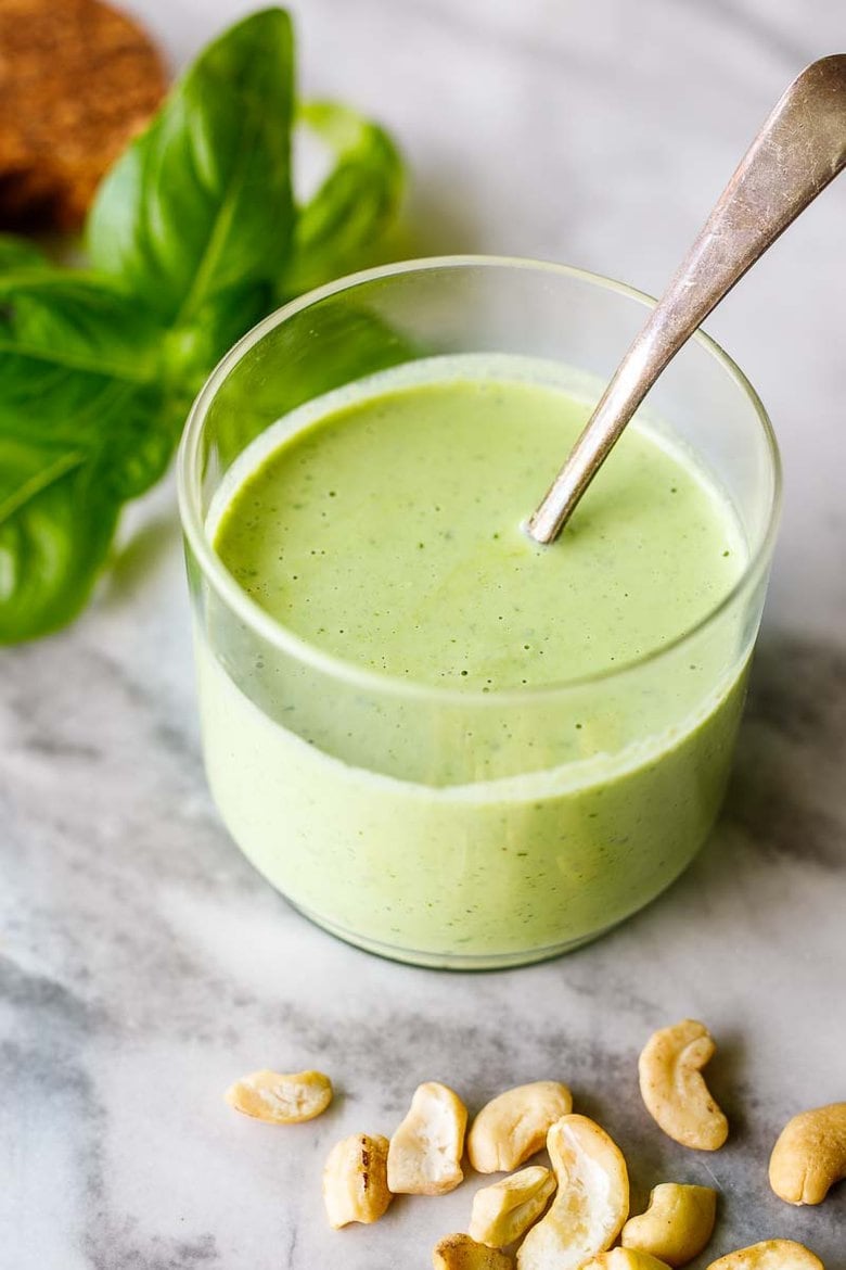 Creamy Cashew Basil Dressing - tangy, creamy, vegan and full of summer flavor. Use on crispy-crunchy lettuces like romaine and little gems and perfect with summer tomatoes.