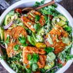 The BEST Grilled Salmon Salad with Avocado, Arugula, Cucumber, Pepitas, Cotija Cheese & Creamy Cilantro Lime Dressing-perfect for summer barbecues and outdoor gatherings. Chock full of fresh organic produce, not only is this entree salad healthy and easy to make, it's bursting with delicious summertime flavor! Keto and Low-carb.