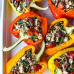 Filled with flavor, protein and fresh ingredients these Mediterranean Stuffed Peppers are completely adaptable, easy to make and can be prepared ahead for a healthy weeknight dinner.