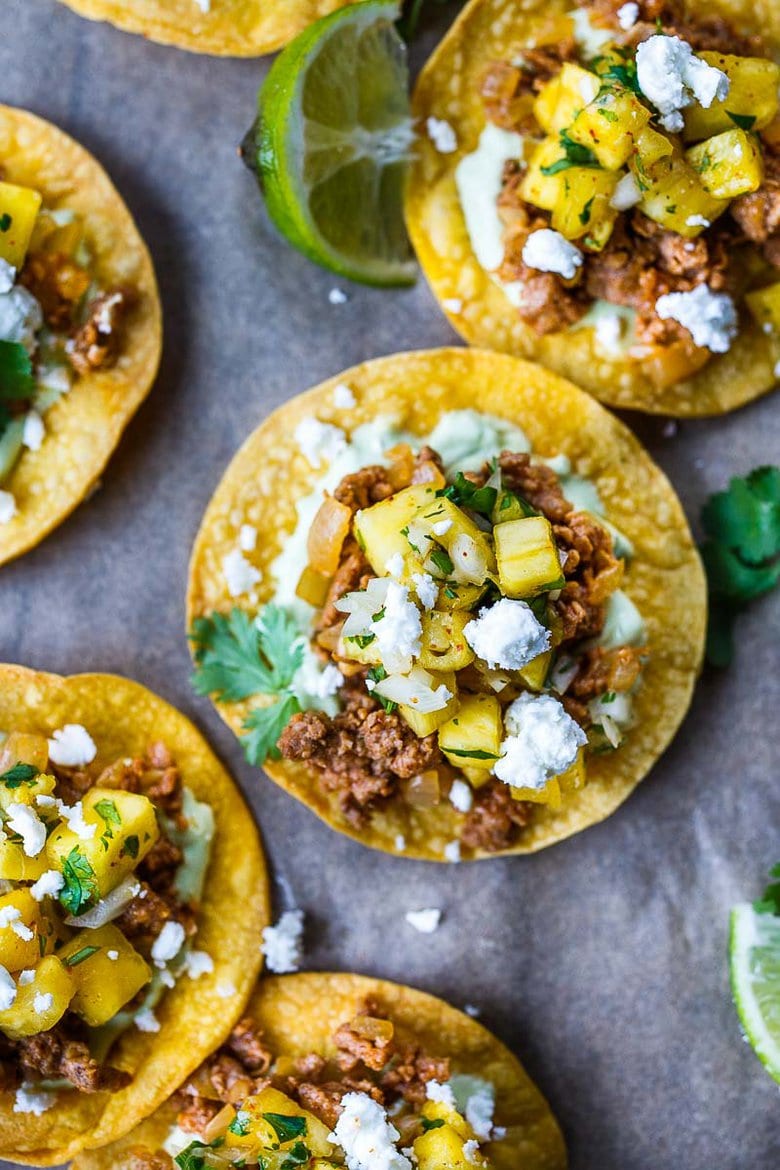 Chipotle Tostadas are crunchy, fresh and easy to make.  A crispy homemade tostada shell piled with savory ground turkey (or meat of your choice), avocado cream and fresh pineapple salsa.  So good and so easy!