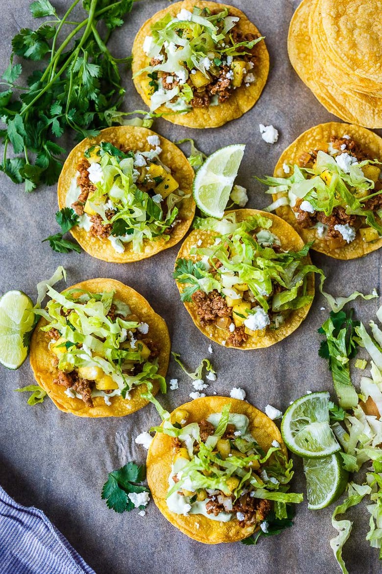 Chipotle Tostadas are crunchy, fresh and easy to make.  A crispy homemade tostada shell piled with savory ground turkey (or meat of your choice!), avocado cream and fresh pineapple salsa.  So good and so easy!