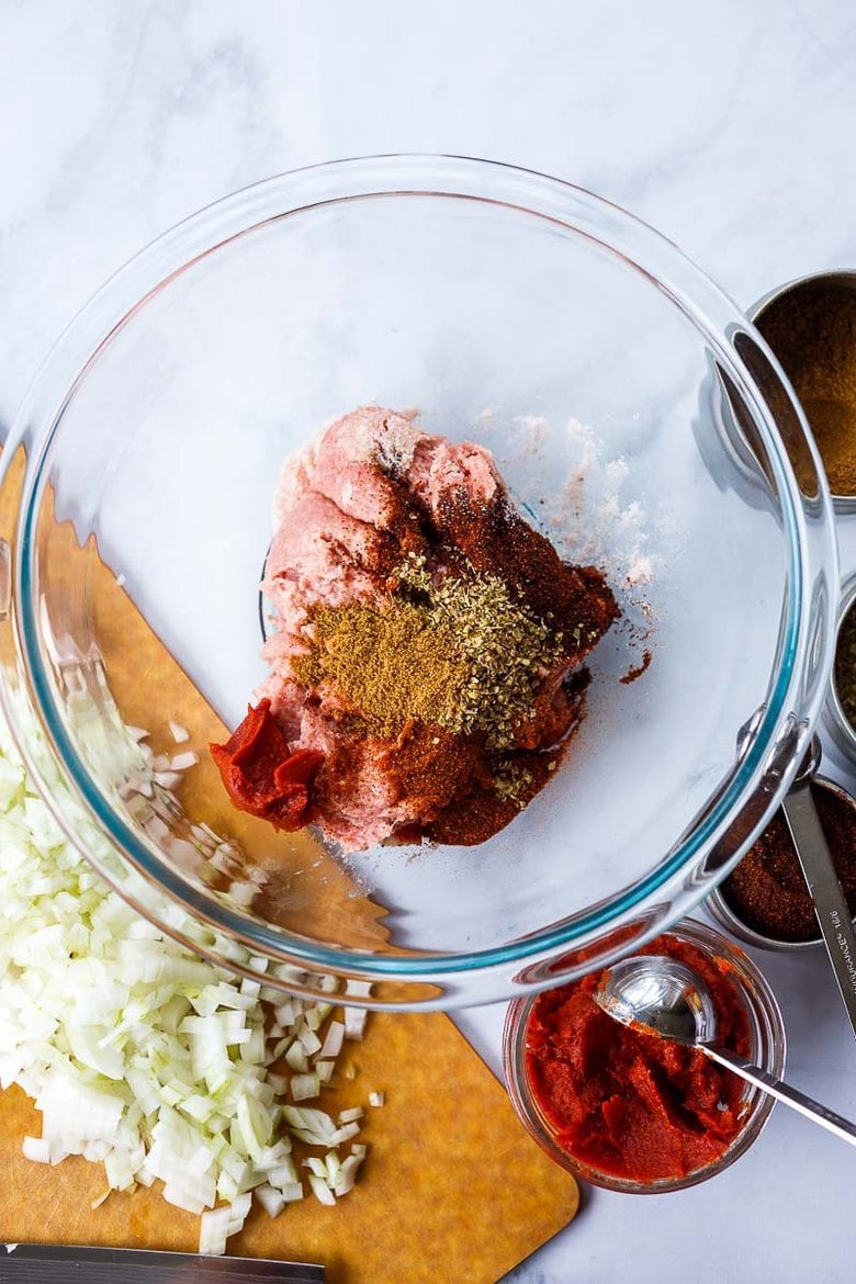 mixing spices into turkey