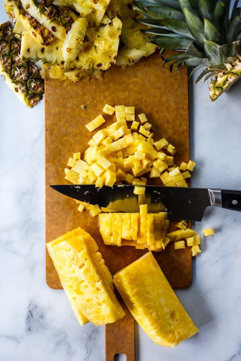 cutting up a fresh pineapple