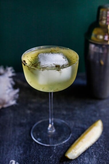 Gin and Brine is a cool summer cocktail made with probiotic, dilly pickle brine, celery bitters and your choice of gin.  A fun twist on a dirty martini.