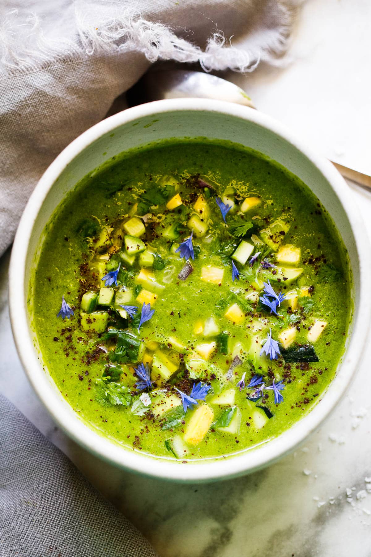 Here's a refreshing recipe for Green Gazpacho - a chilled raw soup, made with fresh garden ingredients that can be made in 15 minutes. A nourishing and delicious summer treat! 