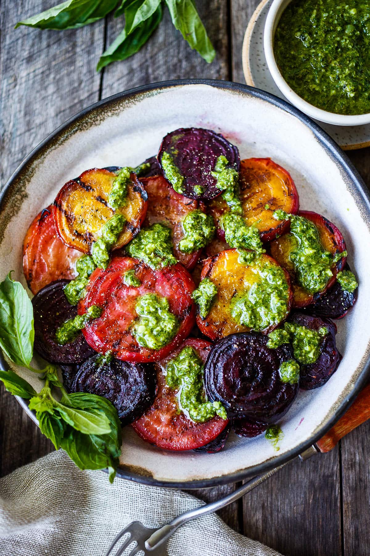 These Grilled Beets are perfectly tender with a rich caramelized flavor.  Top with pesto for over-the-top deliciousness.  Perfect as a side dish, or add to salads, toasts and bowls.