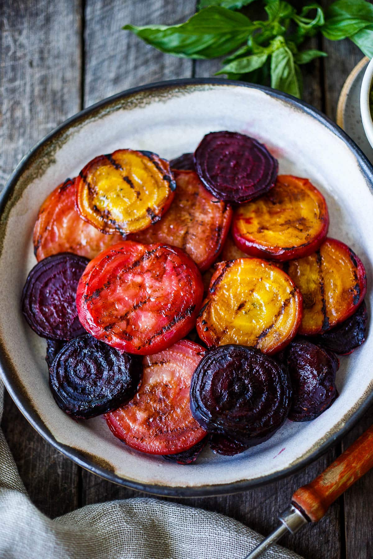 These Grilled Beets are perfectly tender with a rich caramelized flavor.  Top with pesto for over-the-top deliciousness.  Perfect as a side dish, or add to salads, toasts and bowls.
