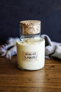 This simple, easy mayonnaise recipe is made with olive oil and can be made in a blender, food processor,  whisked by hand, or use an immersion blender. Keep it in the fridge for up to 3 weeks!