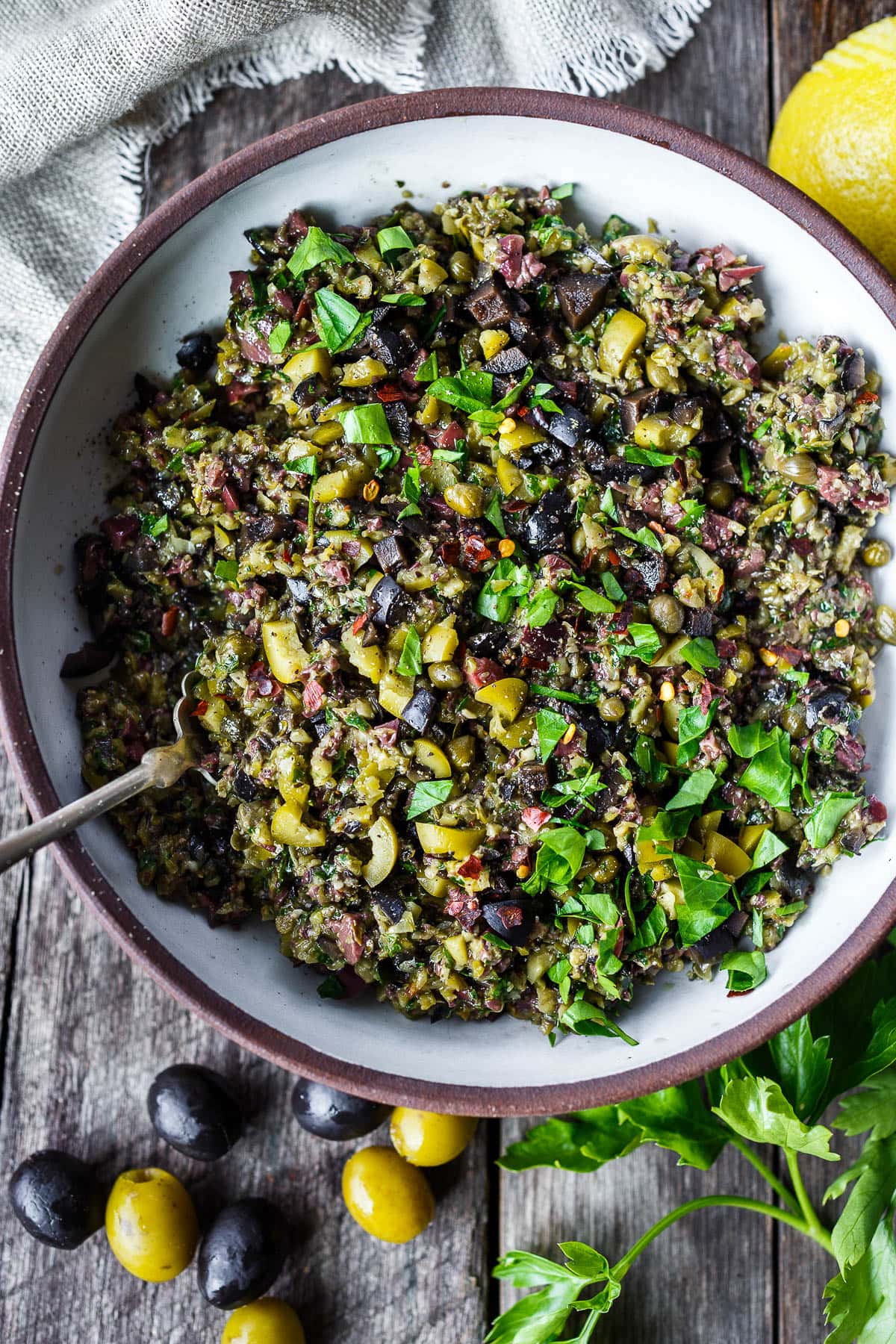 Versatile and full of flavor, Olive Tapenade is a simple, elegant appetizer that comes together in just 10 minutes with no cooking required -perfect for warm summer nights! 