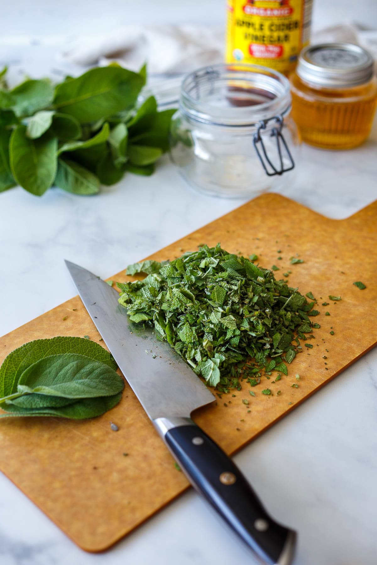 Chopping fresh sage.