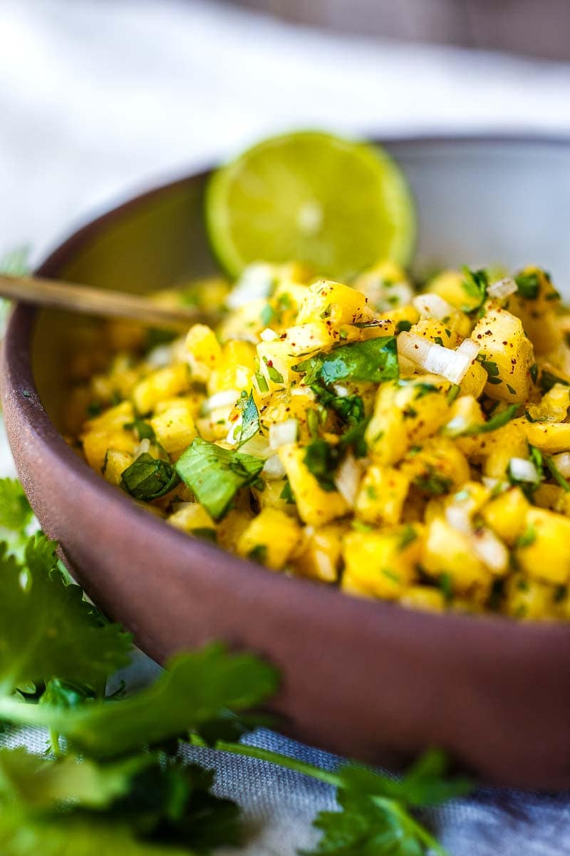 Made with a few simple ingredients, this fresh Pineapple Salsa with chipotle is perfectly balanced and bursting with juicy delicious flavor!  Try it for an incredible complement to tacos, tostadas, burgers, fish, tofu and more!