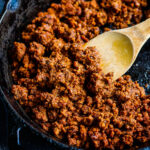 Smoky, savory, spicy Vegan Chorizo made with walnuts and lentils and Mexican Spices- a tasty plant-based alternative to chorizo to use in tacos, tostadas, quesadillas, burritos, burrito bowls, nachos or breakfast bowls. Make it ahead and keep it in the fridge for busy weeknights!