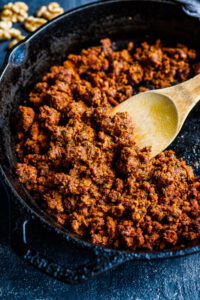 Smoky, savory, spicy Vegan Chorizo made with walnuts and lentils and Mexican Spices- a tasty plant-based alternative to chorizo to use in tacos, tostadas, quesadillas, burritos, burrito bowls, nachos or breakfast bowls. Make it ahead and keep it in the fridge for busy weeknights! 