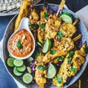 This recipe for Chicken Satay is bursting with authentic Thai flavor! Chicken (or tofu) is bathed in a fragrant marinade of coconut milk and Thai spices, then grilled to perfection and served with a flavorful peanut dipping sauce.  Vegan-adaptable!