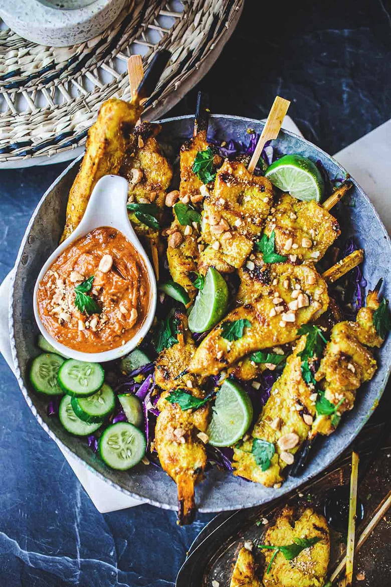 This recipe for Chicken Satay with Peanut Dipping Sauce is bursting with authentic Thai flavor! Chicken (or tofu) is bathed in a fragrant marinade of coconut milk and Thai spices, then grilled to perfection and served with a flavorful satay dipping sauce.  Vegan-adaptable!